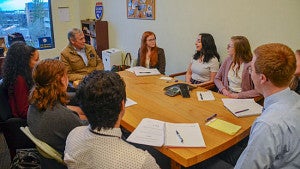 Sen. Merkley with student; credit Oregon Capitol Chronicle