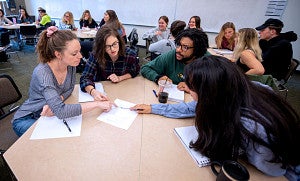 Students working together - UO stock image