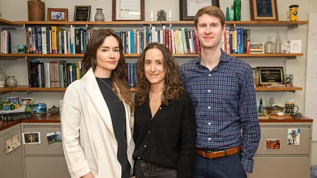Kate McLaughlin stands with two other researchers