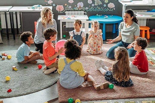 Health specialist leading a childs class