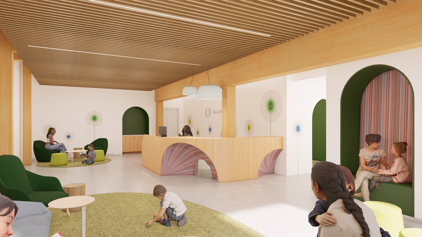 Rendering of the behavioral health clinic with timber columns and desk and textured walls. Children and parents interact in the foreground.