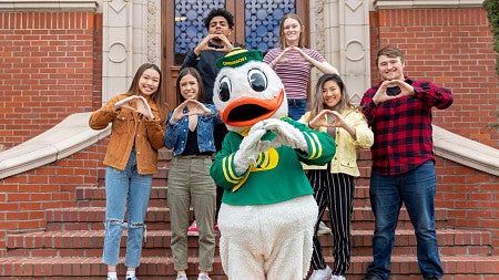 Students throw their O with the duck