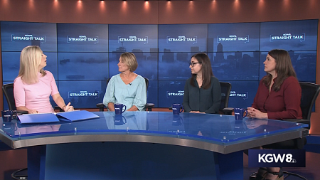 Four people having a discussion on the local news