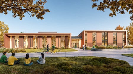 Architectural rendering of the Child Behavioral Health Building, featuring a brown metal and wood exterior with large floor-to-ceiling windows and an exterior lawn