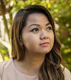 woman stares off camera for a portrait