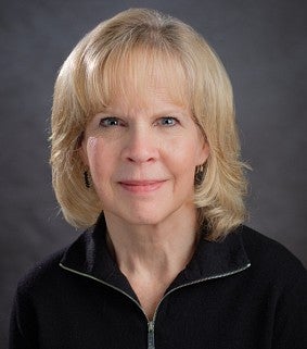 woman smiles for a portrait