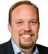 a headshot of a smiling man